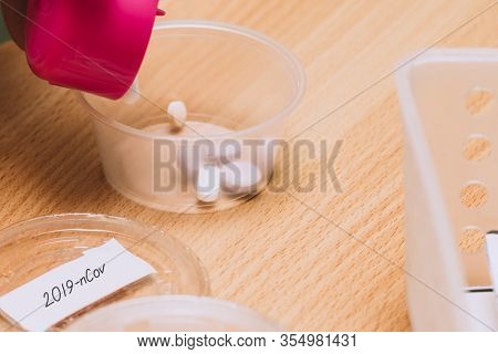 Pills Throwing To Individual Conteiner. Medications For Patients In A Hospital. Novel Coronavirus Di