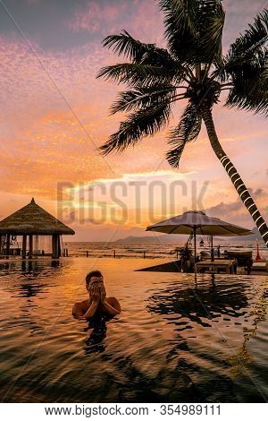 Luxury Swimming Pool In Tropical Resort, Relaxing Holidays In Seychelles Islands. La Digue, Young Ma
