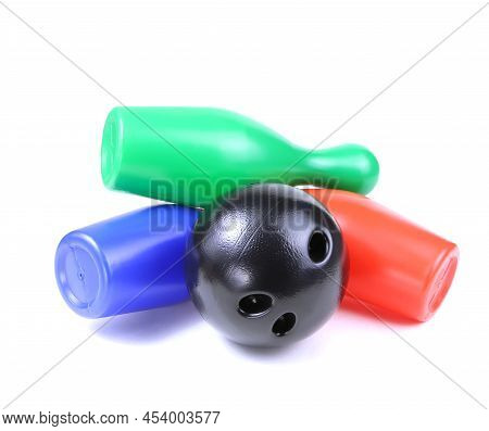 Set Of Collored Bowling Pins And Ball Isolated On A White Background. Skittles Isolated On A White B