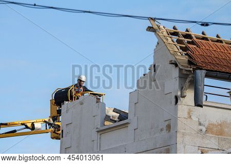 Arcachon, France - February 22, 2022: Selective Blur On A Construction Worker, A Demolition Worker R