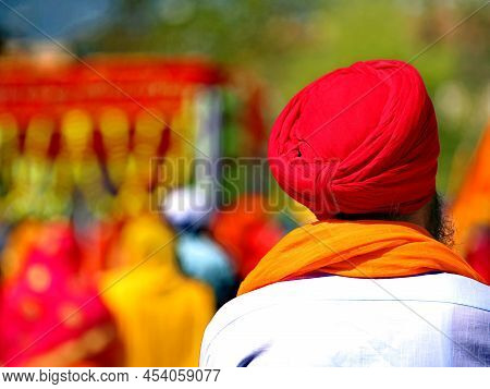 Red Turban Worn By A Bearded Man Of Sikh Religion
