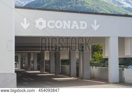 Carrara, Italy - May 6, 2022 - Entrance And Sign Of A Conad Supermarket