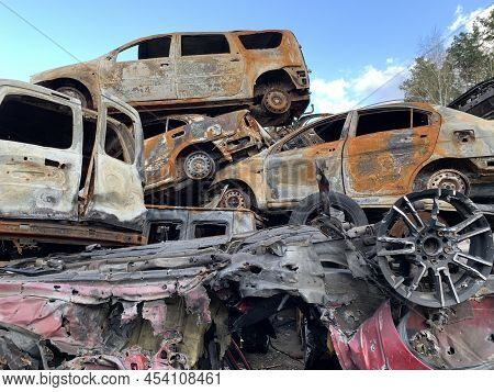 Burnt And Blown Up Car. Traces Of Shots On The Body Of The Car. Cars Damaged After Shelling. War Bet