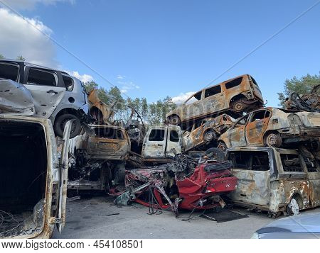 Burnt And Blown Up Car. Traces Of Shots On The Body Of The Car. Cars Damaged After Shelling. War Bet