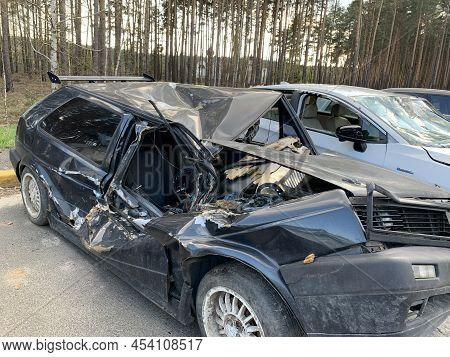 Burnt And Blown Up Car. Traces Of Shots On The Body Of The Car. Cars Damaged After Shelling. War Bet
