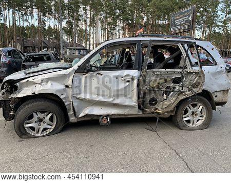 Burnt And Blown Up Car. Traces Of Shots On The Body Of The Car. Cars Damaged After Shelling. War Bet
