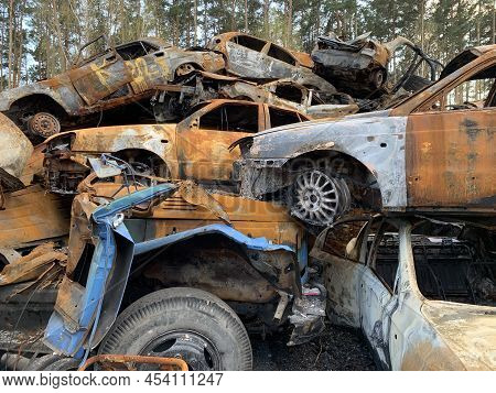 Burnt And Blown Up Car. Traces Of Shots On The Body Of The Car. Cars Damaged After Shelling. War Bet