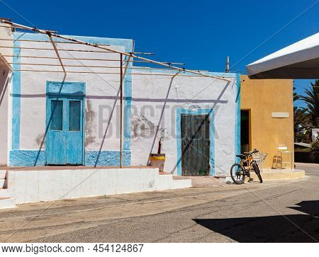 View Of The Typical Linosa House Painted With White And Blue Colors In The Summer Season. Linosa Is 