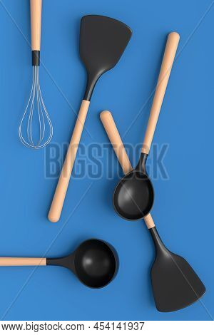 Wooden Kitchen Utensils, Tools And Equipment On Blue Background.