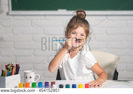 Child Girl Drawing With Coloring Pens Paintind. Portrait Of Adorable Little Girl Smiling Happily Whi