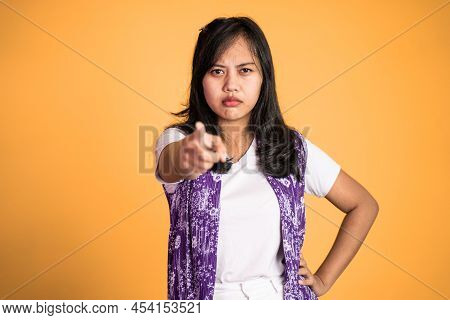 Woman With Finger Pointing At Frong And Laughing At Something
