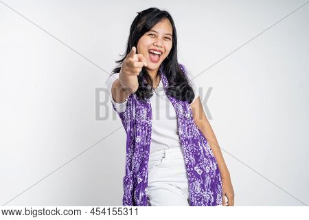 Woman With Finger Pointing At Frong And Laughing At Something