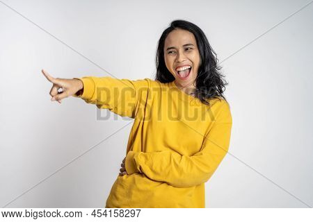 Woman With Finger Pointing At Frong And Laughing At Something