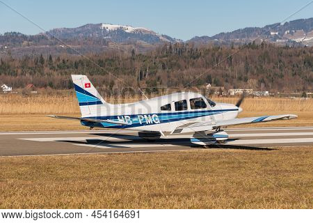 Wangen-lachen, Switzerland, February 13, 2022 Piper Pa-28-181 Archer Ii Is Taxiing On A Small Airfie