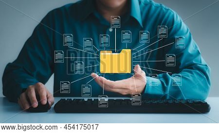 Document Management System Concept, Business Man Holding Folder And Document Icon Software, Searchin