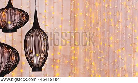 Black Ethnic Lanterns On Background With Light Bulbs. Eastern Lamps On Festive Ramadan Background. H