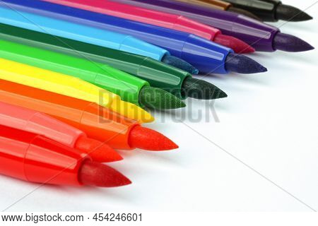 A Set Of Colorful Felt-tip Pens Lying Diagonally On White Background. Learning Concept
