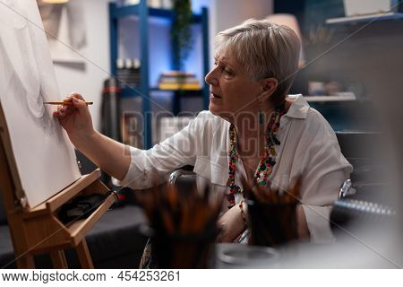 Elderly Artist Shading Static Nature Model Of Vase Using Pencil On Paper Canvas In Home Creative Wor