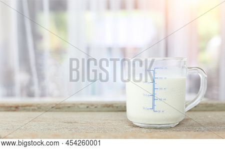 World Milk Day Concept - Glass Of Fresh Cold Rustic Cow Milk - High Protein And Calcium On A Wooden