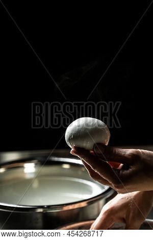 Cheesemaker, Showing Freshly Made Mozzarella. The Homemade Cheese Maker Produces Caciocavallo. Pasta