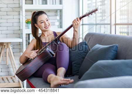 Millennial Asian Young Beautiful Healthy Slim Strong Sexy Female Sporty Model In Casual Crop Top Spo