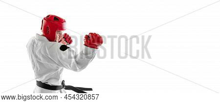 Flyer With Portrait Of Young Sportive Man Wearing White Dobok, Helmet And Gloves Practicing Isolated