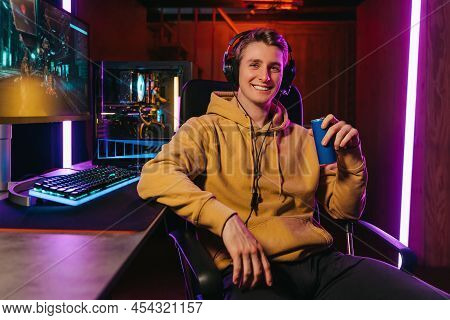 Happy Handsome Pro Cyber Sportsman Smiling At Camera