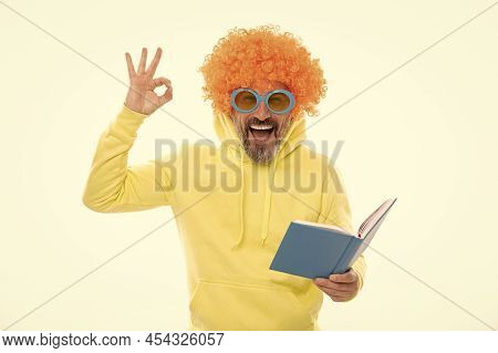 Happy Man In Funky Wig Show Ok Sign Gesture Reading School Book In Geek Sunglasses, Education