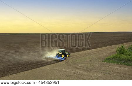 Varna, Bulgaria - March 2, 2022 Ploughing A Field With John Deere 6930 Tractor. John Deere Was Manuf