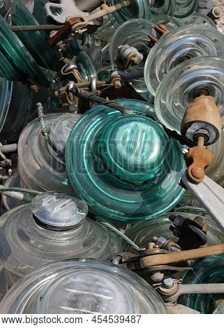 Many Glass Insulators Used In High Voltage Power Lines To Insulate Electrical Conductors And Prevent
