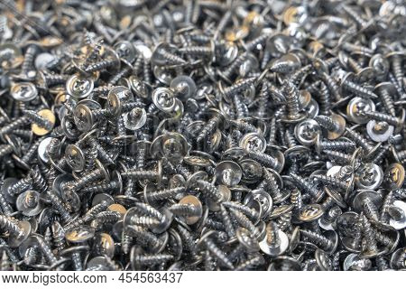 A Lot Of Metal Self-tapping Screws. Background Of Self-tapping Screws.