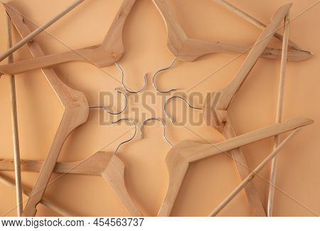 Hangers For Clothes. Hanger Set. Beige Background. Wooden Hangers. Store Shop. Pastel Color. Sale Co