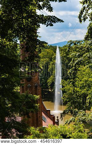 High Fountain In Small Lake In Valley In Park