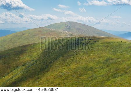 Beautiful Mountain Landscape With Clouds. Top Of Mount Ghimba In The Carpathians