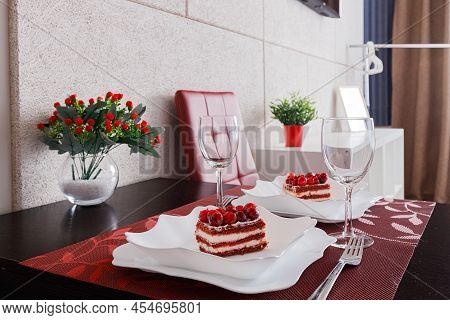 Cakes And Glasses Are On The Table