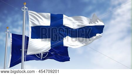 Helsinki, Finland, May 2022: The National Flag Of Finland Waving Along With The Flag Of Nato. In 202