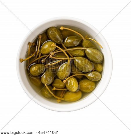 Pickled Caper Berries In A White Bowl Isolated On White Background. Marinated Fruits Of Caper Bush. 