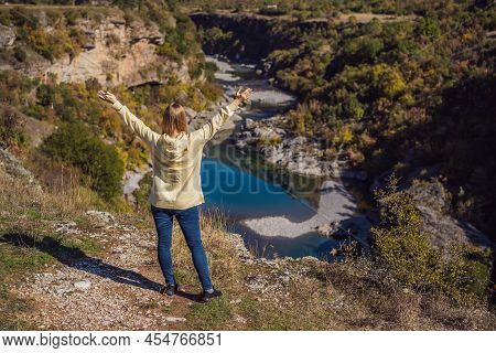 Montenegro. Woman Tourist On The Background Of Clean Clear Turquoise Water Of River Moraca In Green 