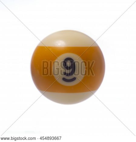 Pool Ball Number 9 Isolated On A White Background. Close Up