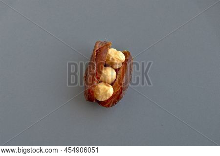 Organic Fresh Nutritious Dried Hurma Dates Medjool Grains, Hazelnuts Placed Inside The Date, In A Gr