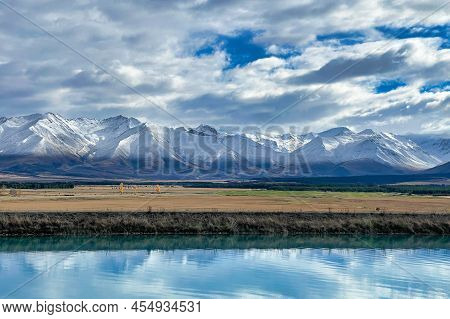 Woke Up This Morning To Snow Covering The Ben Ohau Range With The Blue Blue Water Of The Pukaki Cana