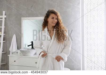 Beautiful Woman Wearing Soft White Robe In Bathroom