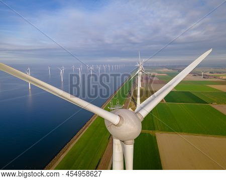 Windmill Farm In The Ocean Westermeerwind Park, Windmills Isolated At Sea On A Beautiful Bright Day 