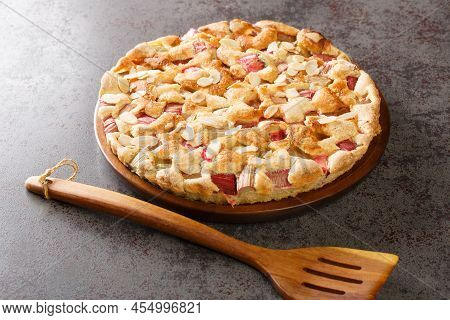 Traditional Fresh Rhubarb Pie With Almonds Close-up In A Dish On The Table. Horizontal