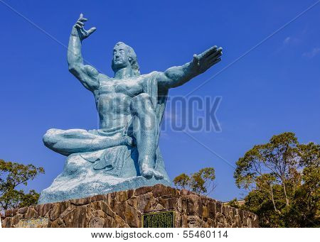 Nagasaki, Japan - November 14 2013: Nagasaki Peace Statue, The Statue's Right Hand Points To The Thr