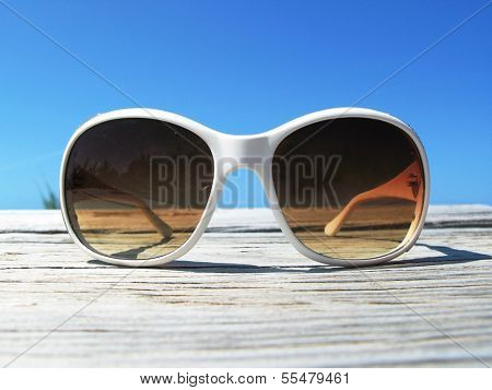 Sunglasses on the wooden jetty. Exuma, Bahamas 