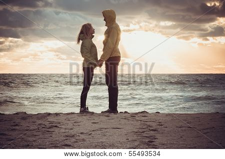 Couple Man And Woman In Love Standing On Beach Seaside Holding Hand In Hand With Beautiful Sunset Sk
