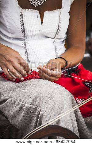 distaff, woman spinning yarn on an old spinning wheel
