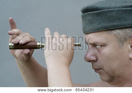 Man Holding  A Spyglass
