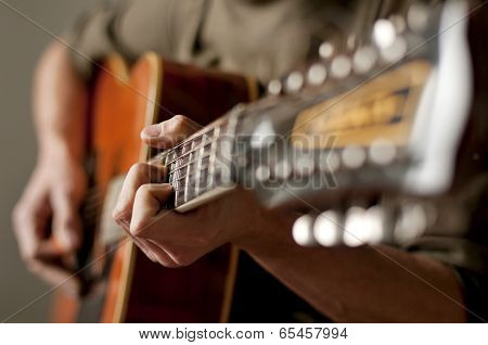 Playing a 12 string acoustic guitar